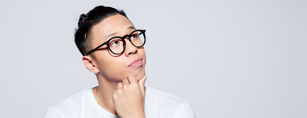 young asian man in glasses