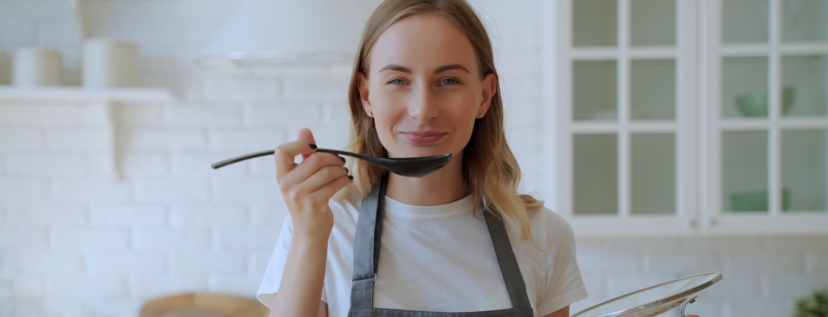 young woman holding spoon