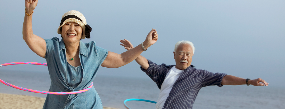 Two seniors hula hooping