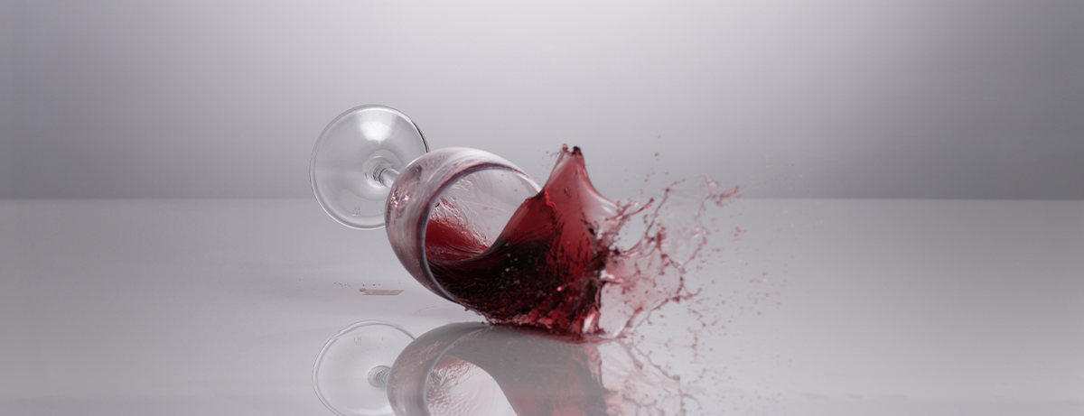 glass of red wine spilling