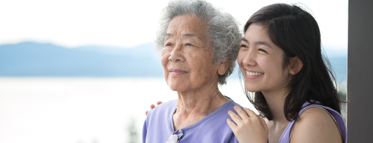 senior and young asian women in purple gazing at landscape