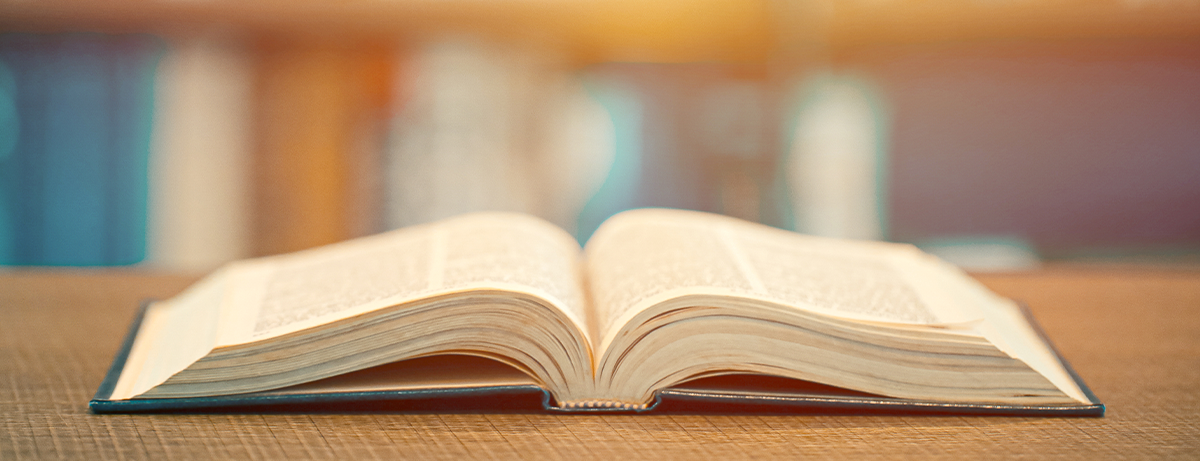 old book laying on a table open