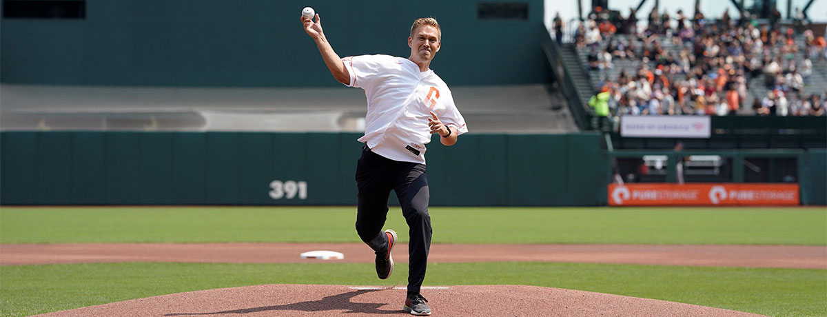 male throwing baseball pitch