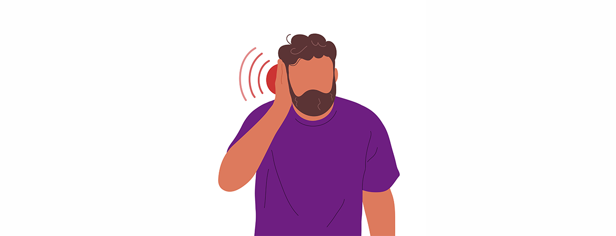 man in purple with ear pain