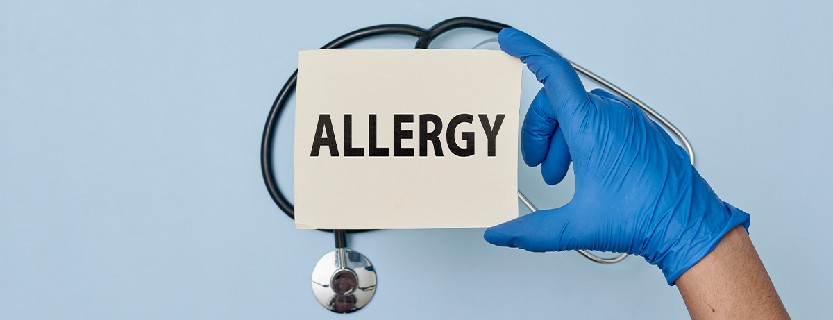 Glove holding allergy card