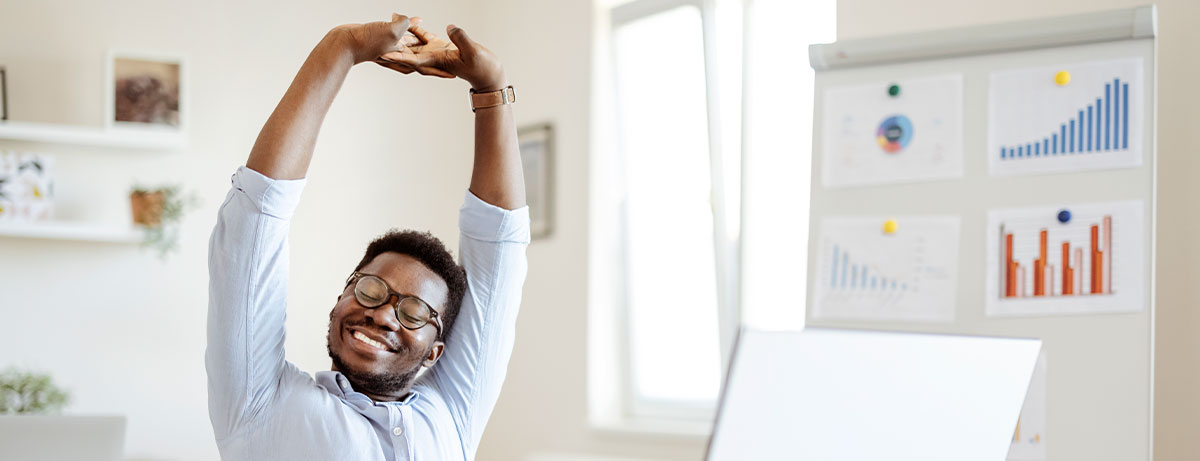 happy stretching at desk