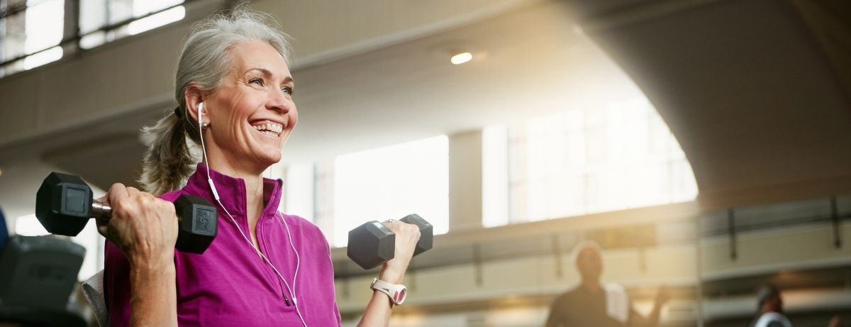 woman in purple with weights