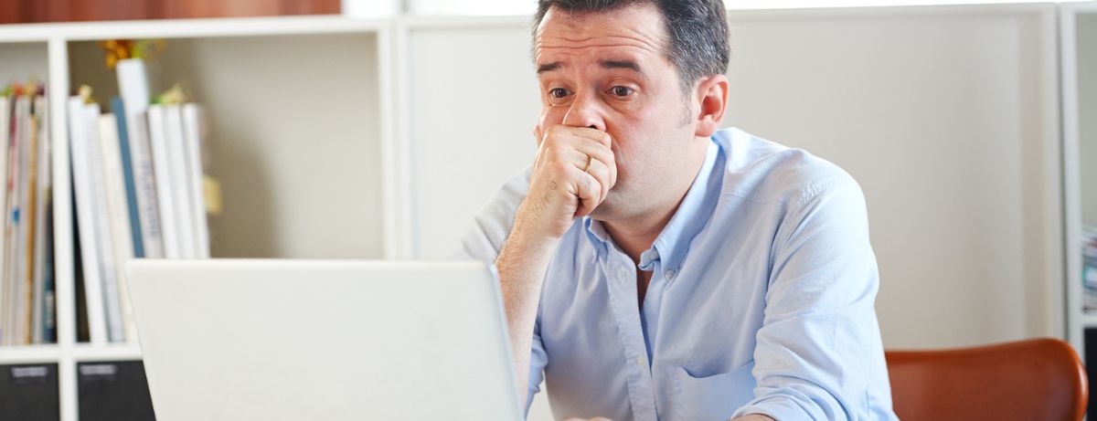 man nervous at laptop