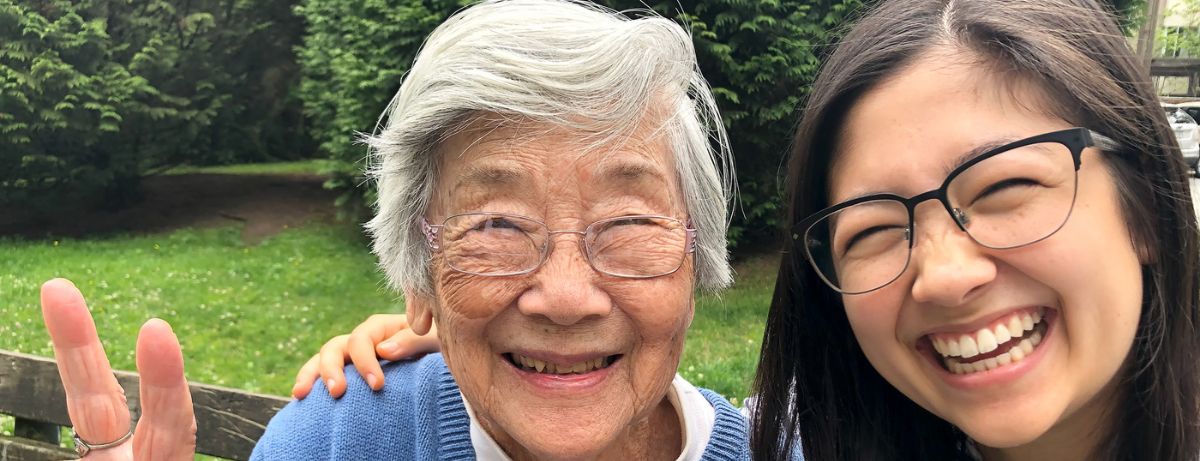 senior and young girl smiling