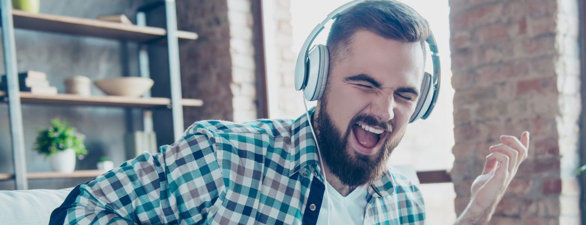 man jamming on air guitar