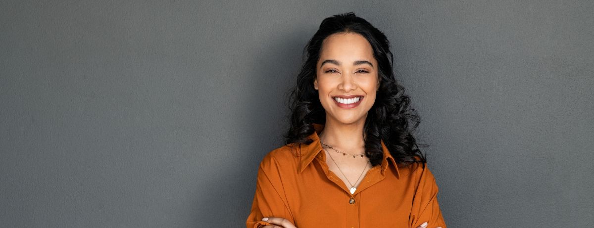 smiling woman wearing orange