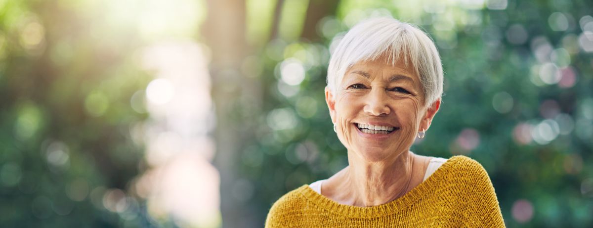 senior woman in mustard sweater