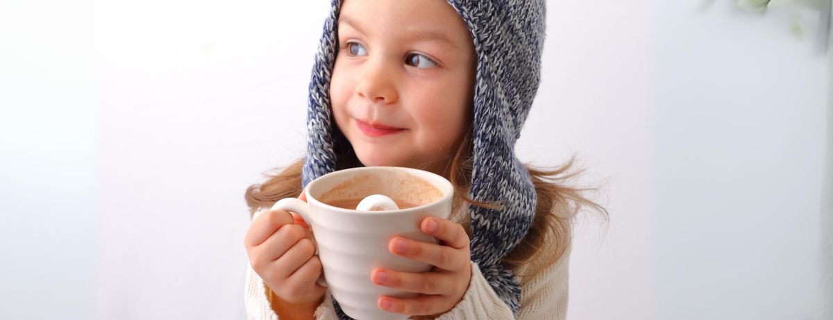 child drinking hot chocolate